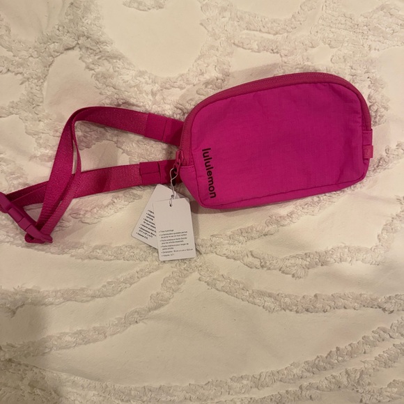lululemon athletica Handbags - Lululemon Fuchsia Crossbody Bag